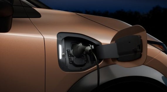Close-up image of charging cable plugged in | Wallace Nissan in Stuart FL